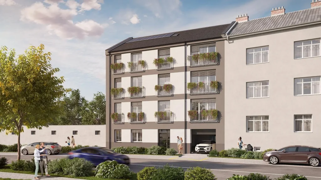 Pohled na bytový dům KŠÍROVA lofts z ulice, krémová fasáda s balkony